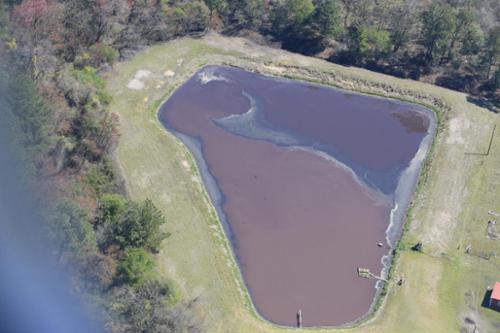 Another lagoon with an appearance of sludge buildup